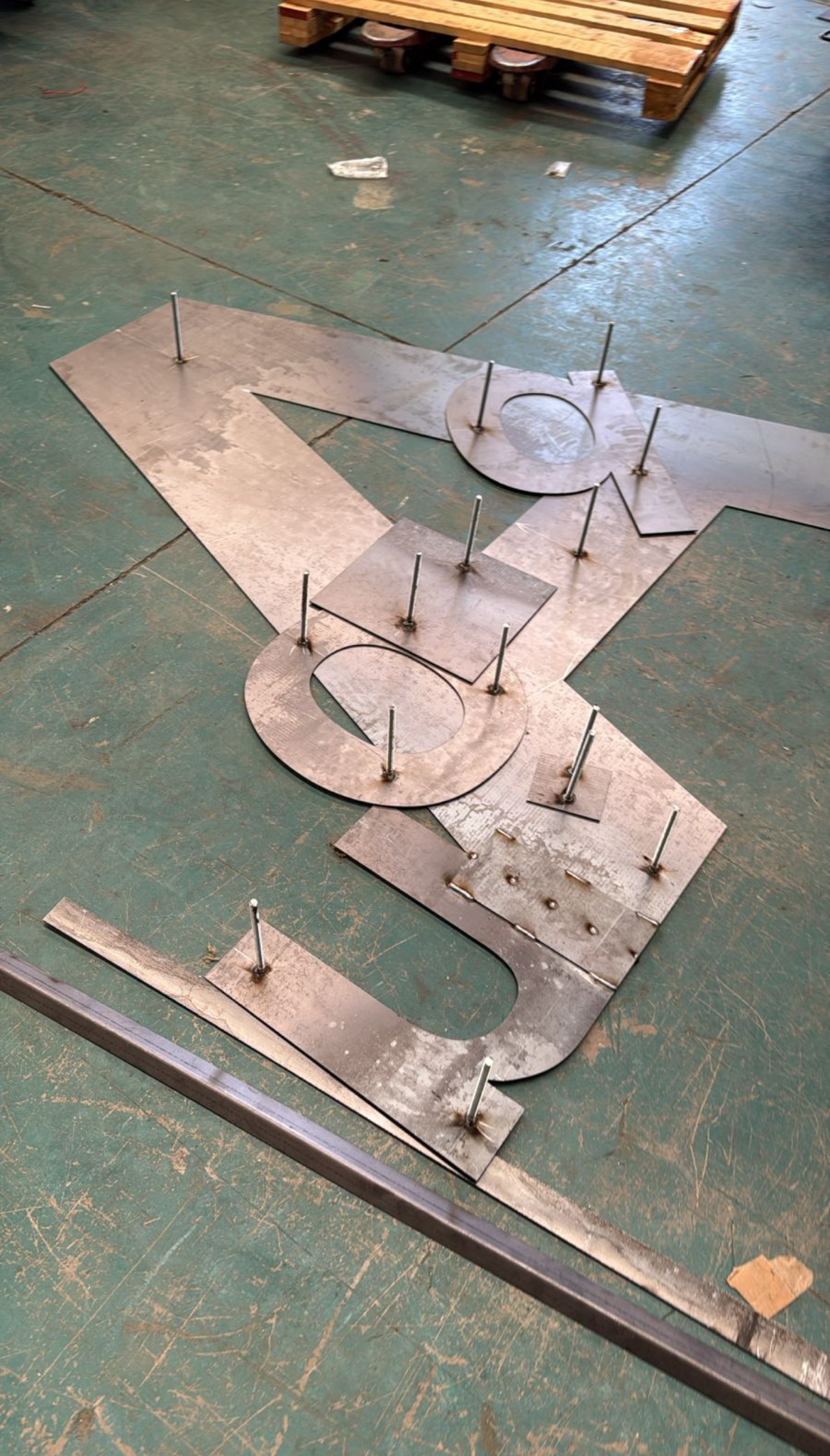 Cut steel sign letters with mounting studs welded on